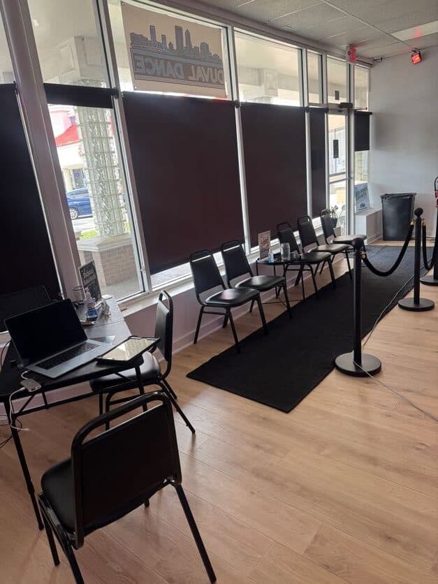 Check-in table and waiting chairs inside the front entrance